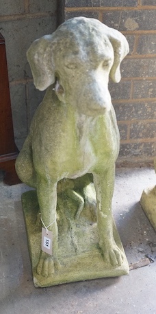 A reconstituted stone seated hound garden ornament, height 72cm